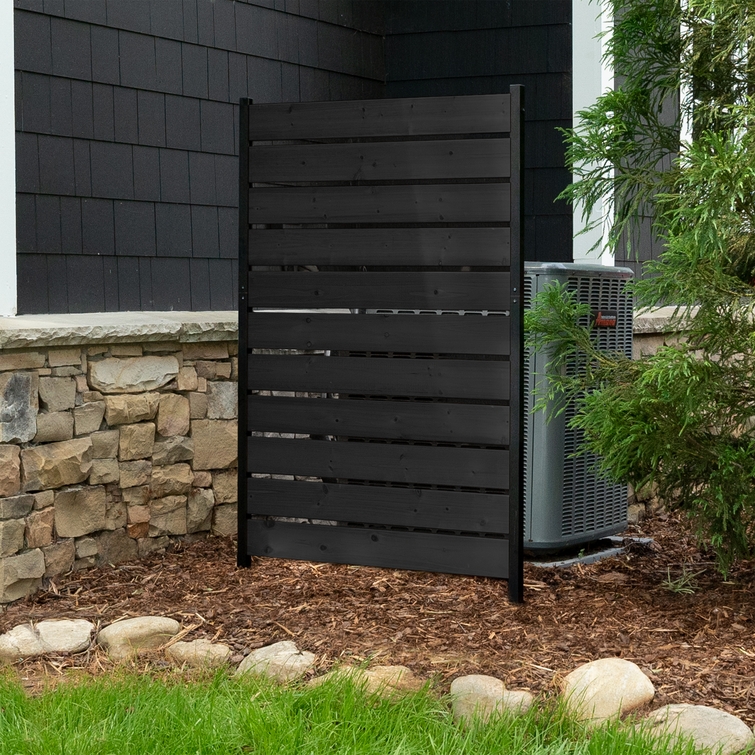 Enclo charcoal wood privacy screen panel concealing an outdoor air conditioner unit beside a house