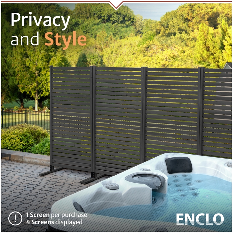 Multiple charcoal Enclo Tiaga privacy screens installed behind a hot tub creating stylish outdoor privacy