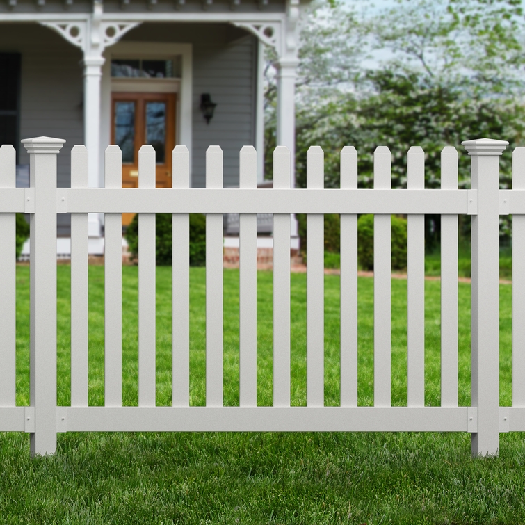 Installed All-American flat top white vinyl picket fence surrounding a residential front yard