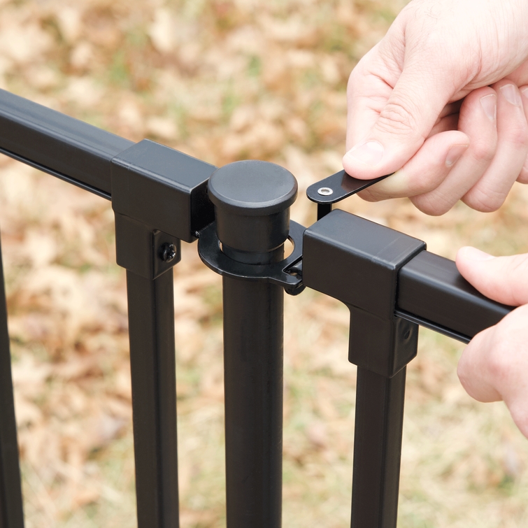 Hand operating gate latch on Zurich fence gate hardware kit demonstrating easy open and close function