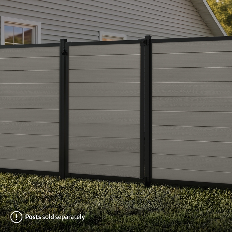6 ft tall composite privacy fence with slate gray composite boards, black aluminum frame, and matching walk gate shown closed between fence panels.