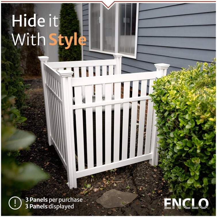 Decorative white outdoor privacy fence concealing air conditioning unit beside house landscaping