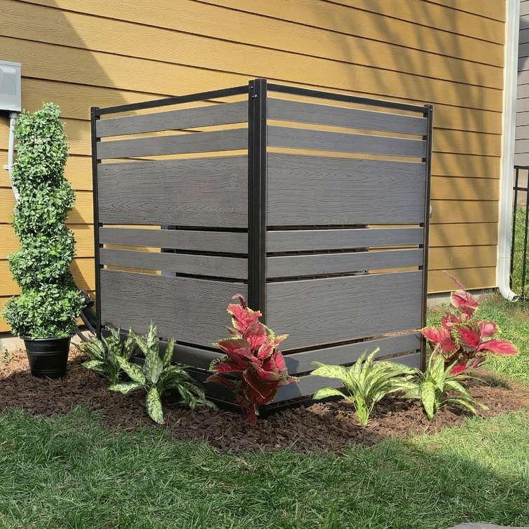 Modern gray outdoor privacy screen with black aluminum frame and wood-look composite horizontal slat panels