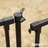 Installed gate latch hardware on black Zurich metal fence showing secure connection between gate panel and post