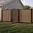 6 ft tall composite privacy fence with walnut brown composite boards, black aluminum frame, and matching walk gate installed in a residential backyard.