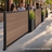 4 ft Edgewood aluminum fence panels with planters forming a low privacy screen along an outdoor café patio
